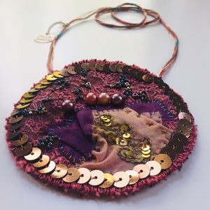 Handmade one of a kind up-cycled fabric necklace.